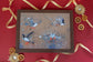 close-up of puffin artwork on lap tray surface